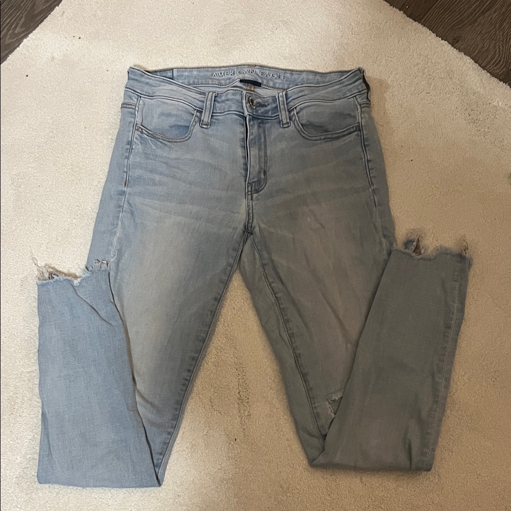 American Eagle Outfitters Light Blue Skinny Jeans with Distressed Hem